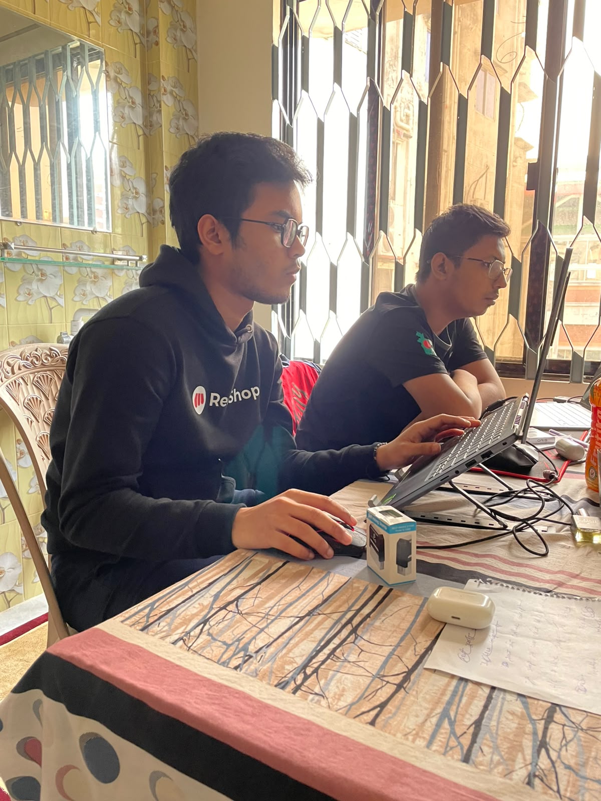 Working side by side at the dining table